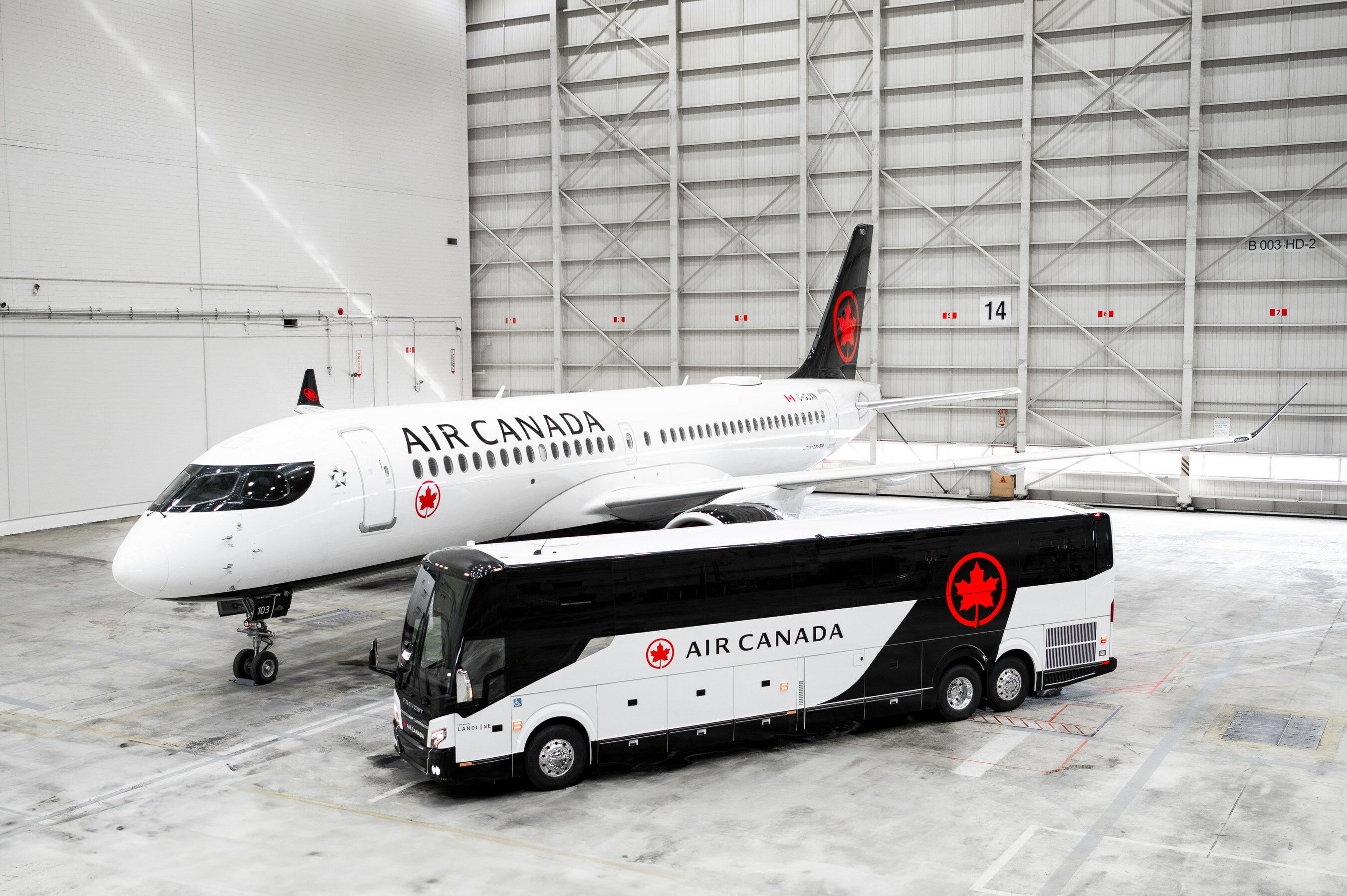 Air Canada aircraft and Landline coach in hangar